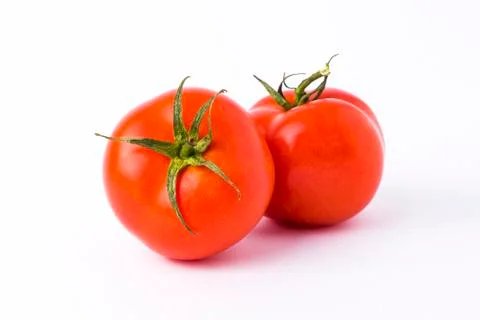 Studio shot of two tomatoes on white background Stock Photos