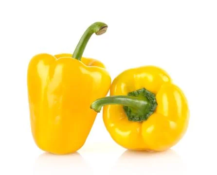 Studio shot of two yellow bell peppers isolated on white background Stock Photos