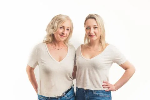 Studio shot on white background of two similarly looking middle-aged women Stock Photos