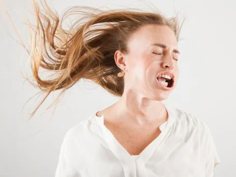Studio shot of woman with windblown mouth Stock Photos