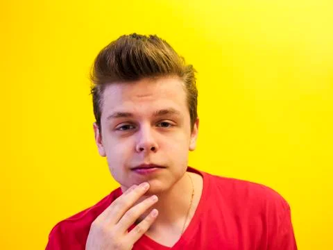Studio shot of a young handsome guy on a colored background Stock Photos