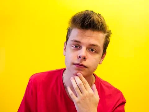 Studio shot of a young handsome guy on a colored background Stock Photos