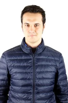 Studio shot of a young man with blue anorak Stock Photos