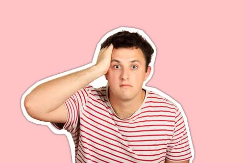 Studio shot of young man looking shocked with hand on head. emotional guy iso Stock Photos