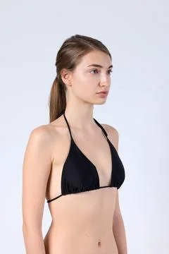 Studio Side Profile Model in Black Halter Bikini Foto stock