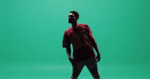 Studio, a silhouette of a young man dancing in a shadow Stock Footage 116081319