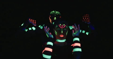 Studio, slow motion, a couple of neon-clad dancers showing off moves Vídeo Stock 140416430
