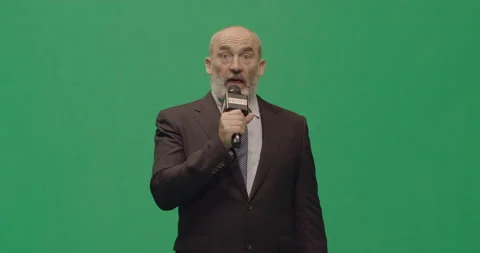 Studio, slow motion, green screen, a concerned mature male reporter, London, UK Stock Footage 146644760