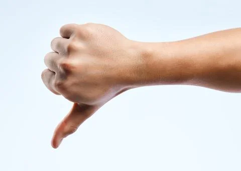 Studio, thumb down and opinion with hand gesture, vote and sign for negative Stock Photos