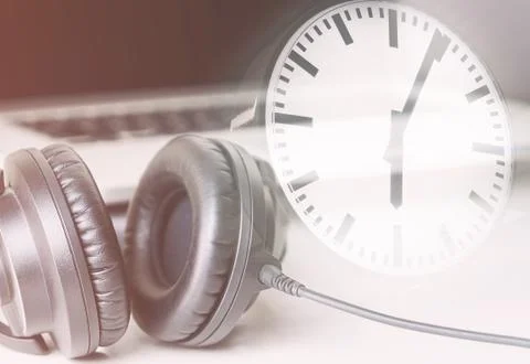 Studio time concept with computer studio and clock counting time 库存照片