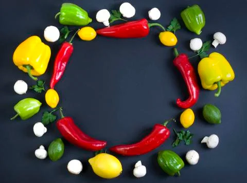 Studio top view shot of kitchen vegetables on dark background Stock Photos