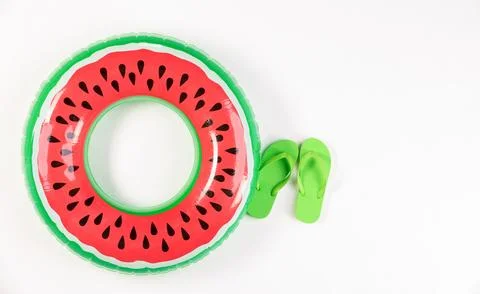 Studio top view shot two pairs of red and green rubber casual unisex slippe.. 写真素材