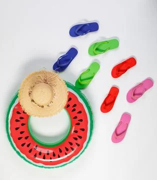 Studio top view shot two pairs of red and green rubber casual unisex slippe.. 写真素材