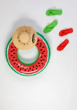 Studio top view shot two pairs of red and green rubber casual unisex slippe.. Stock Photos