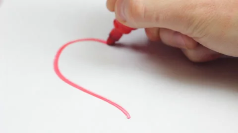 Studio video of male hand drawing a universal heart with red marker on whit.. Stock Footage 233468883
