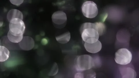 Studio video of multi-colored bokeh light leaks in the dark Stock-Footage 317535682