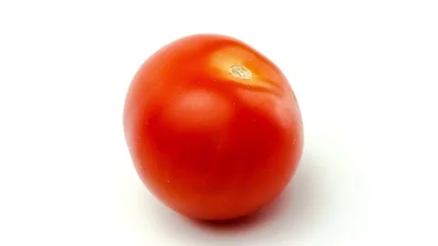 Studio video shot of red organic tomato on white Stock Footage 83482660