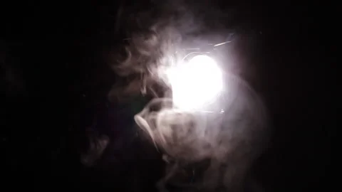 Studio video of single spotlight being turned on on black background Stock Footage 233416156