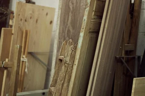 Studio with wooden door frames in different shapes and sizes Stock Photos