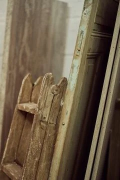 Studio with wooden door frames in different shapes and sizes Stock Photos