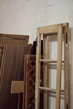 Studio with wooden door frames in different shapes and sizes Stock Photos