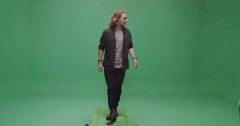 Studio, a young man walks on the treadmill towards the camera, London, UK Stock Footage 140516399