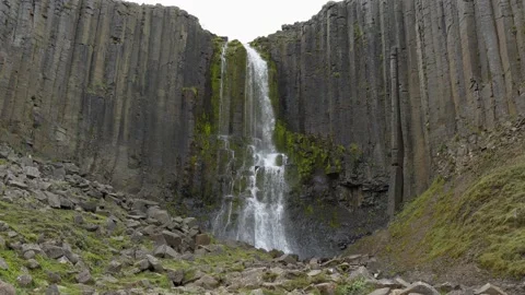 Stuðlafoss Waterfall Surrounded by Basalt Column Formations in Iceland Stock Footage 339875199