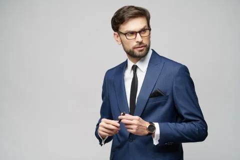 Studuo shot of thinking solving problem businessman wearing suit holding pen Stock Photos