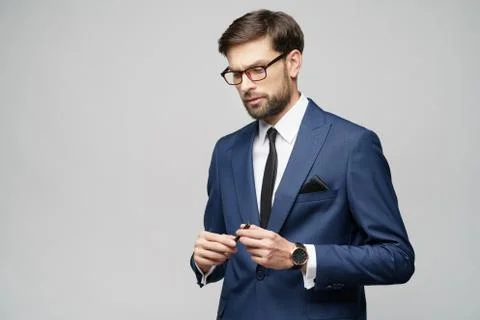 Studuo shot of thinking solving problem businessman wearing suit holding pen Stock Photos