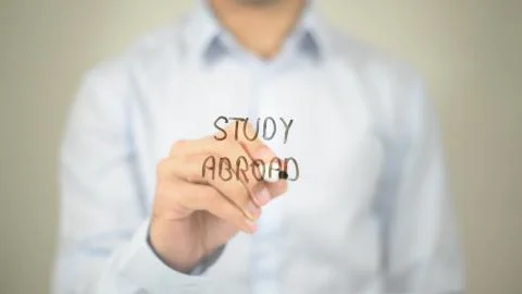 Study Abroad, Man Writing on Transparent Screen 写真素材