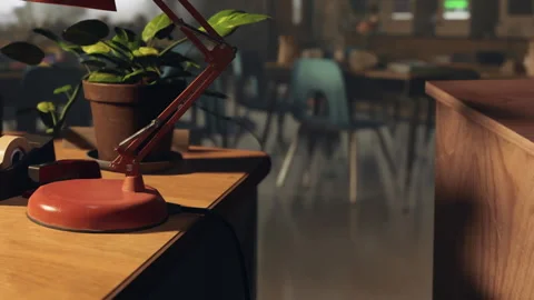 Study area with red lamp and plant in a classroom setting during daytime Stock Footage 344847155