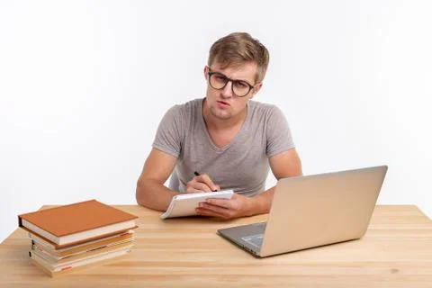 Study, education, people concept - student funny man doing exercises in netbook Stock Photos