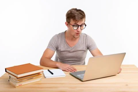 Study, education, people concept - student funny man doing exercises in netbook Stock Photos