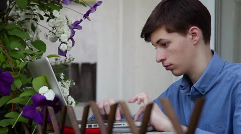 Study for exams in flower garden, preparing, working, school, laptop Stock Footage 39654559