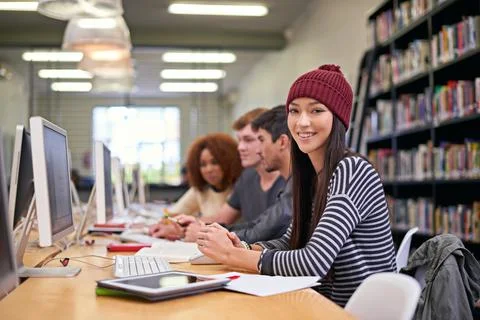 Study group, students and portrait of girl in library for education, assignment Foto stock