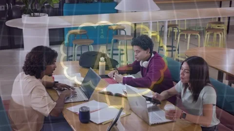 Study group studying at table, center peer showing page, cloud hovering binary Stock Footage 335235557
