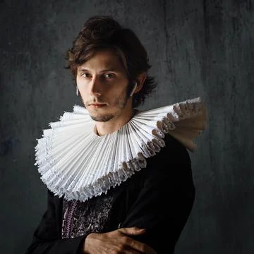 Study the history of art, an audio guide. young man in medieval collar and suit 写真素材