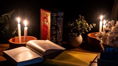 Study Islamic books in candle light Stock Photos