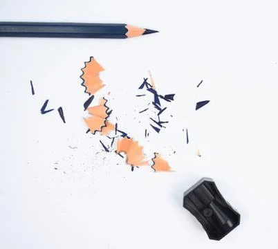 Study materials containing a blue pencil and a black color plastic sharpener Stock Photos