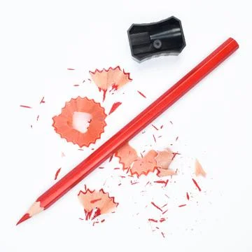 Study materials containing a red pencil and a black color plastic sharpener Stock Photos