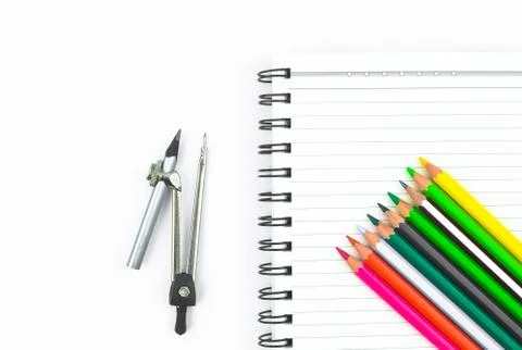Study materials containing a row of different color pencil,a pencil compass a Stock Photos