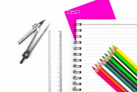 Study materials containing a row of different color pencil,a pencil compass,a Stock Photos
