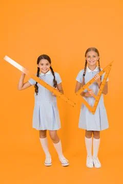 Study math. School students study math. Pupil school girls rulers. School Stock Photos