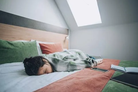 Study overload, featuring a student who has collapsed into sleep Stock Photos