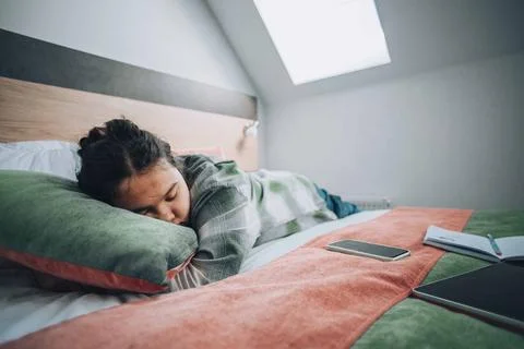 Study overload, featuring a student who has collapsed into sleep Stock Photos