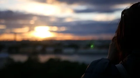 Study the panorama of the city at sunset through a telescope. slow motion Stock Footage 78963580