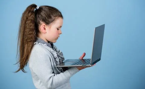 Study programming. Blogging concept. Girl with laptop computer. Little child Stock Photos