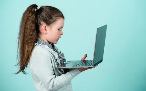 Study programming. Blogging concept. Girl with laptop computer. Little child Stock Photos