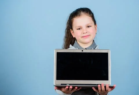 Study programming. Girl with laptop computer. Little child using pc. Life online Foto stock