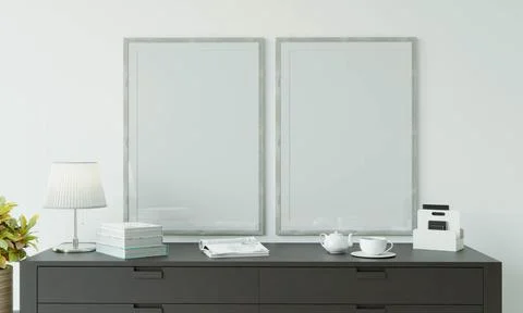 The study room is decorated with a table, picture frames, lamps and small p.. Stock Photos